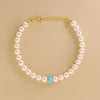 Bracciale Di Perle Bianco Con Perla Colorata